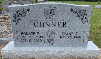 companion upright gray granite headstone with florida gator, cross and roses, and wedding rings
